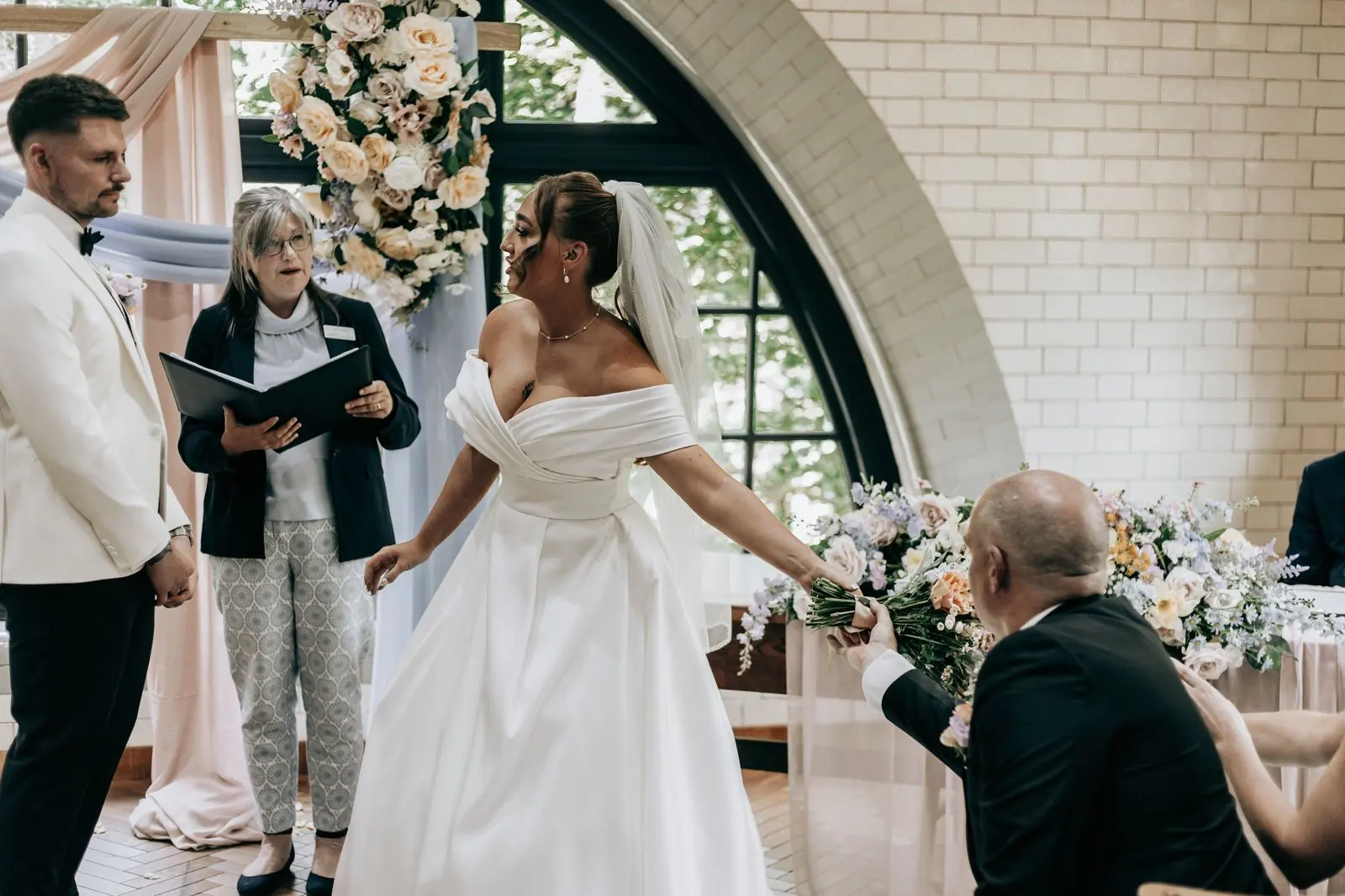 Couple and celebrant during the ceremony